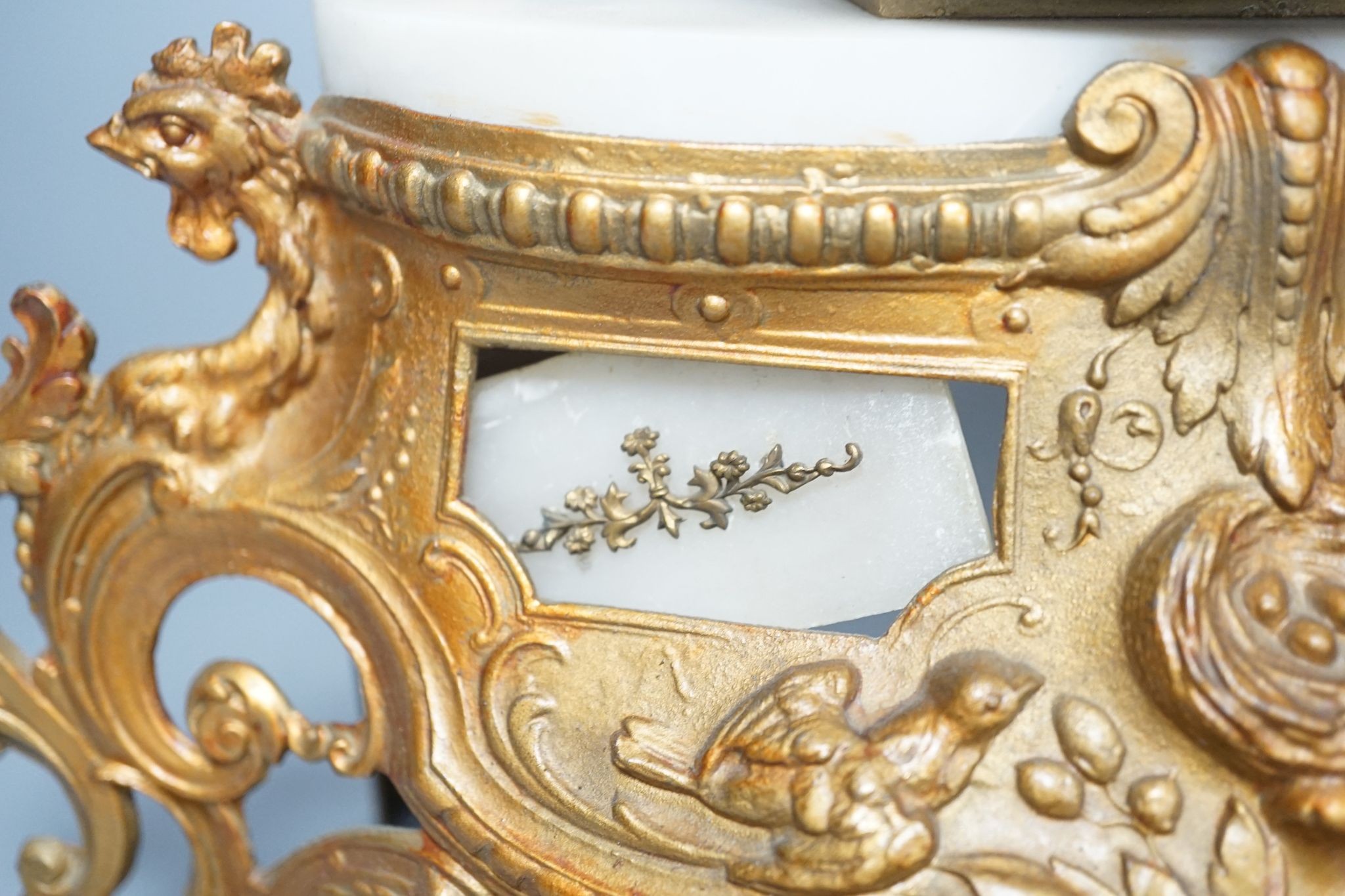 A 19th century French gilt spelter and Alabaster mantel clock, with pendulum, 36cms high.